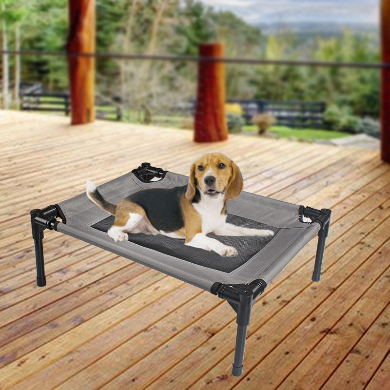 Beagle resting on elevated dog bed on wooden deck, outdoor pet furniture